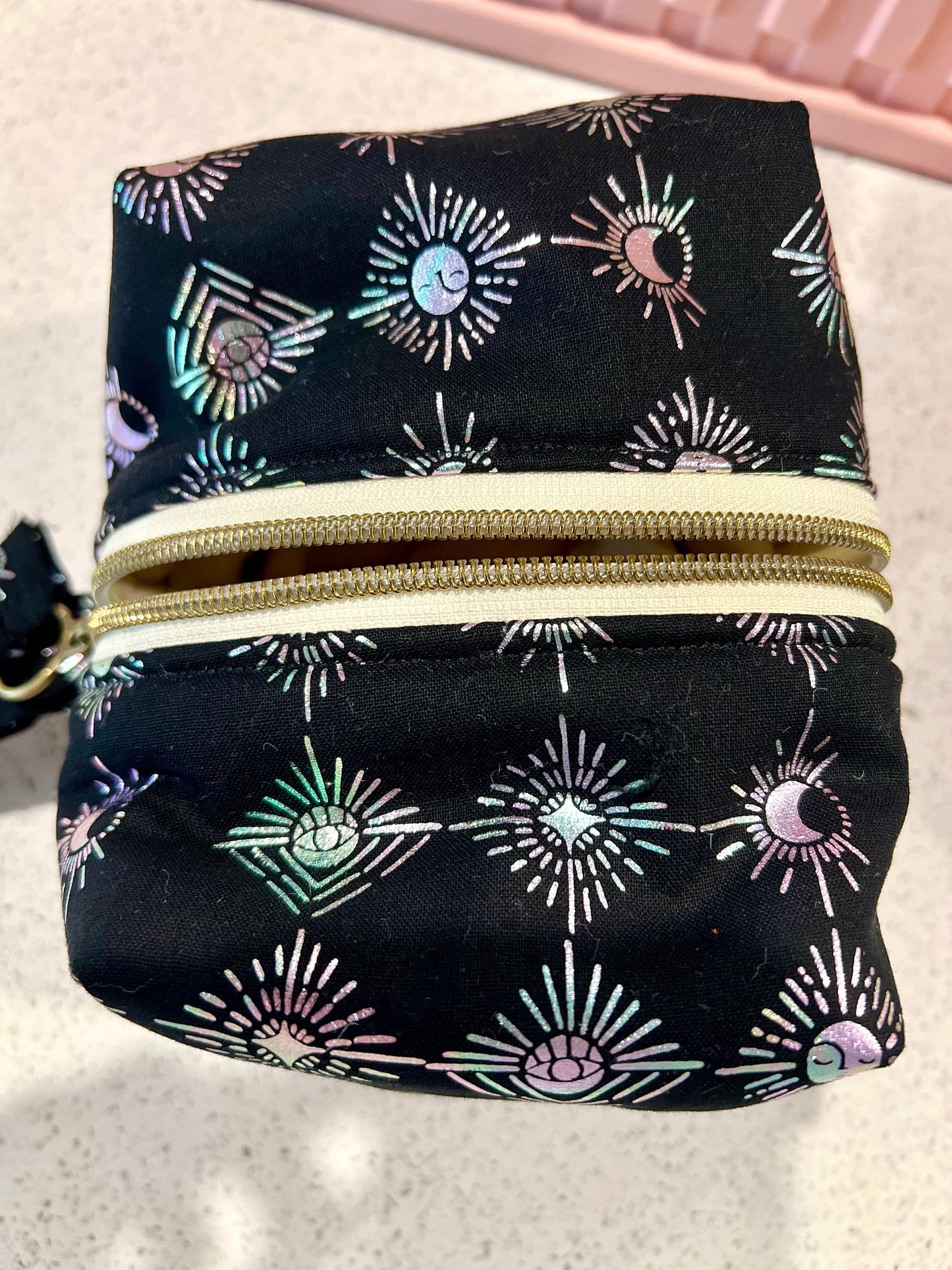 Handmade witchy pouch with celestial design and zipper closure.