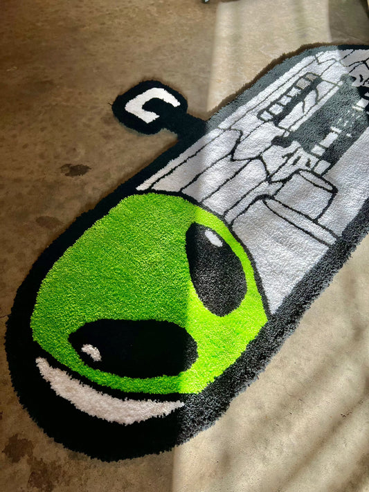 Custom-Alien rug with green alien design, available for commission.