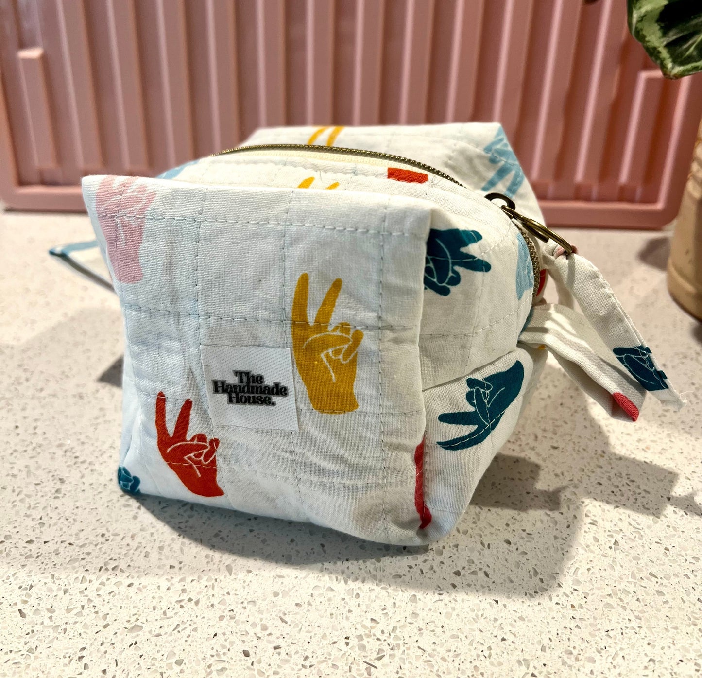 Handmade peace sign pouch with zipper closure, perfect for makeup and art supplies.