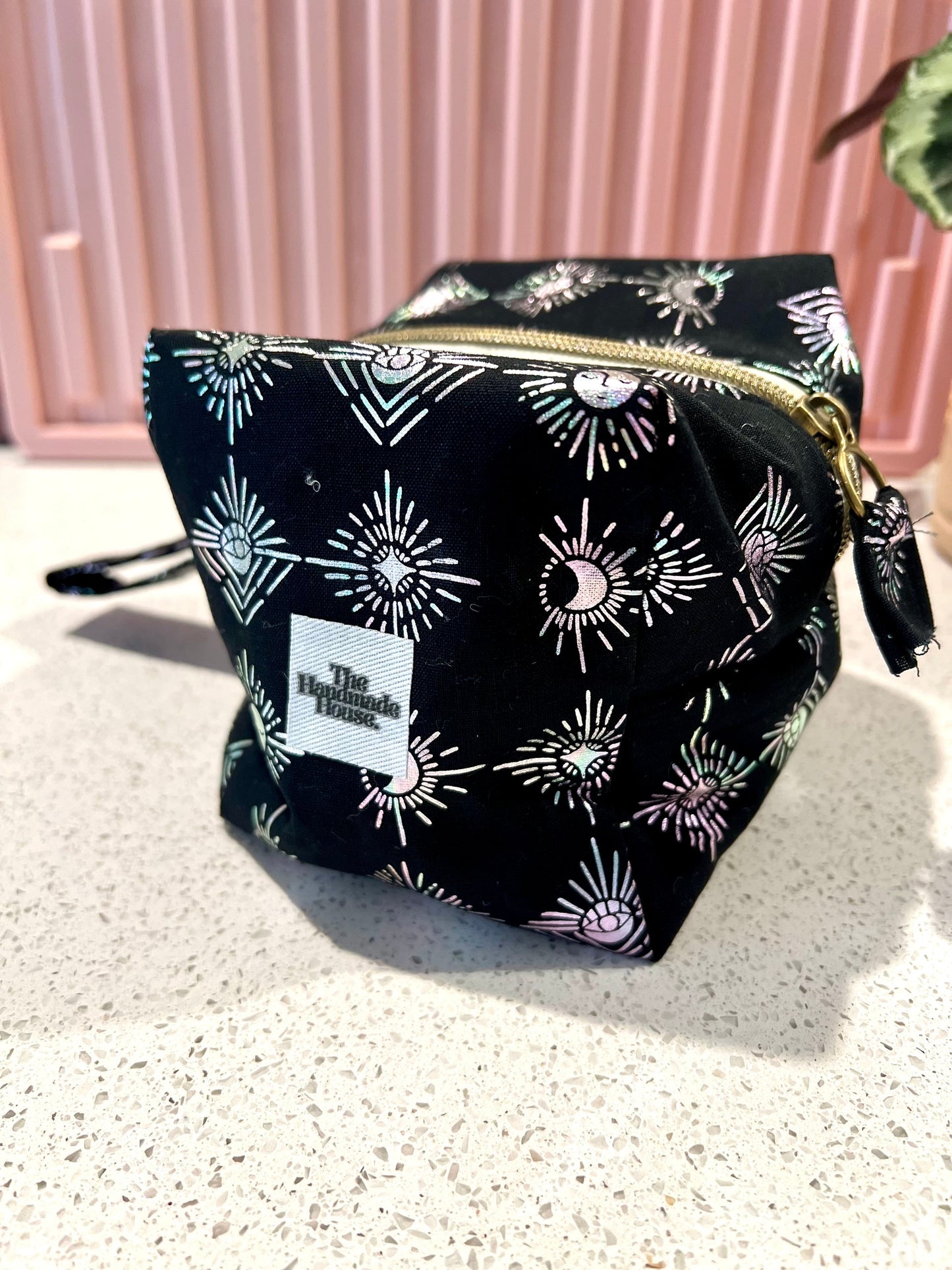 Handmade Witchy Pouch with celestial pattern and zipper closure.