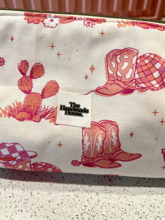 Handmade pink cowgirl pouch with western-themed pattern, ideal for straighteners or art supplies.