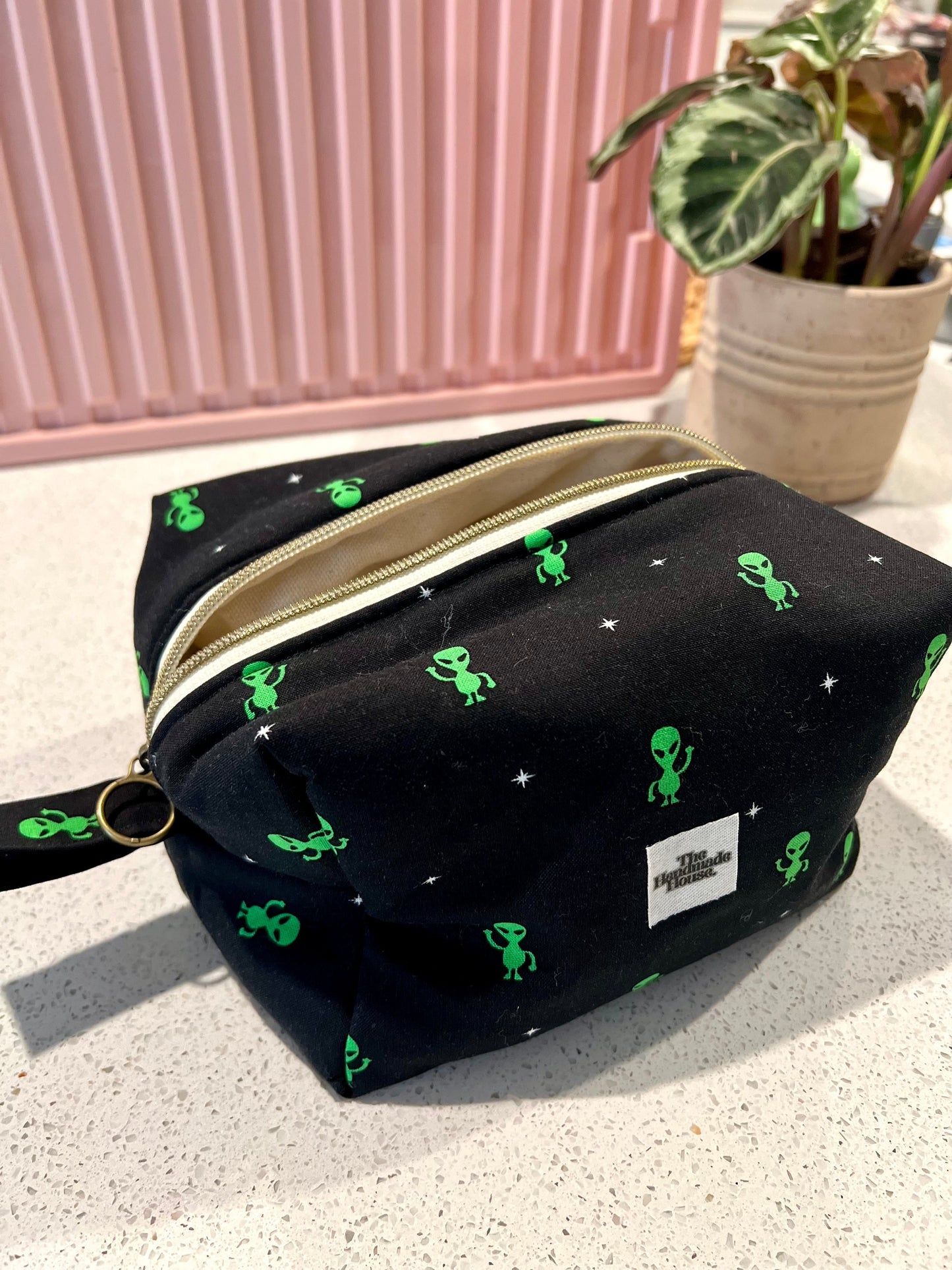 Handmade Alien Pouch with zipper closure, ideal for makeup and art supplies storage.