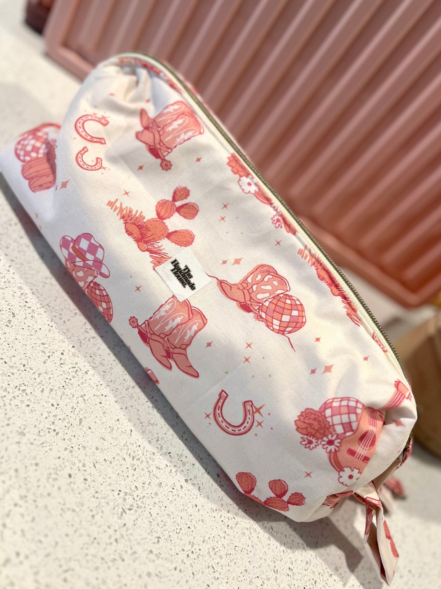Pink cowgirl pouch with zipper closure, holds styling tools or art supplies, 11x3x5 size.