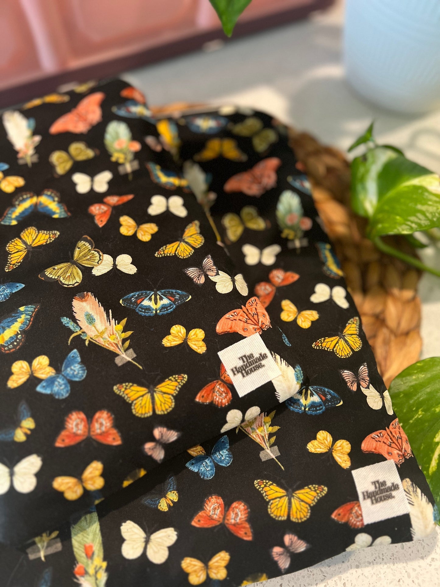 Cute butterfly-themed large book sleeve with a quilted cotton design and zipper closure.