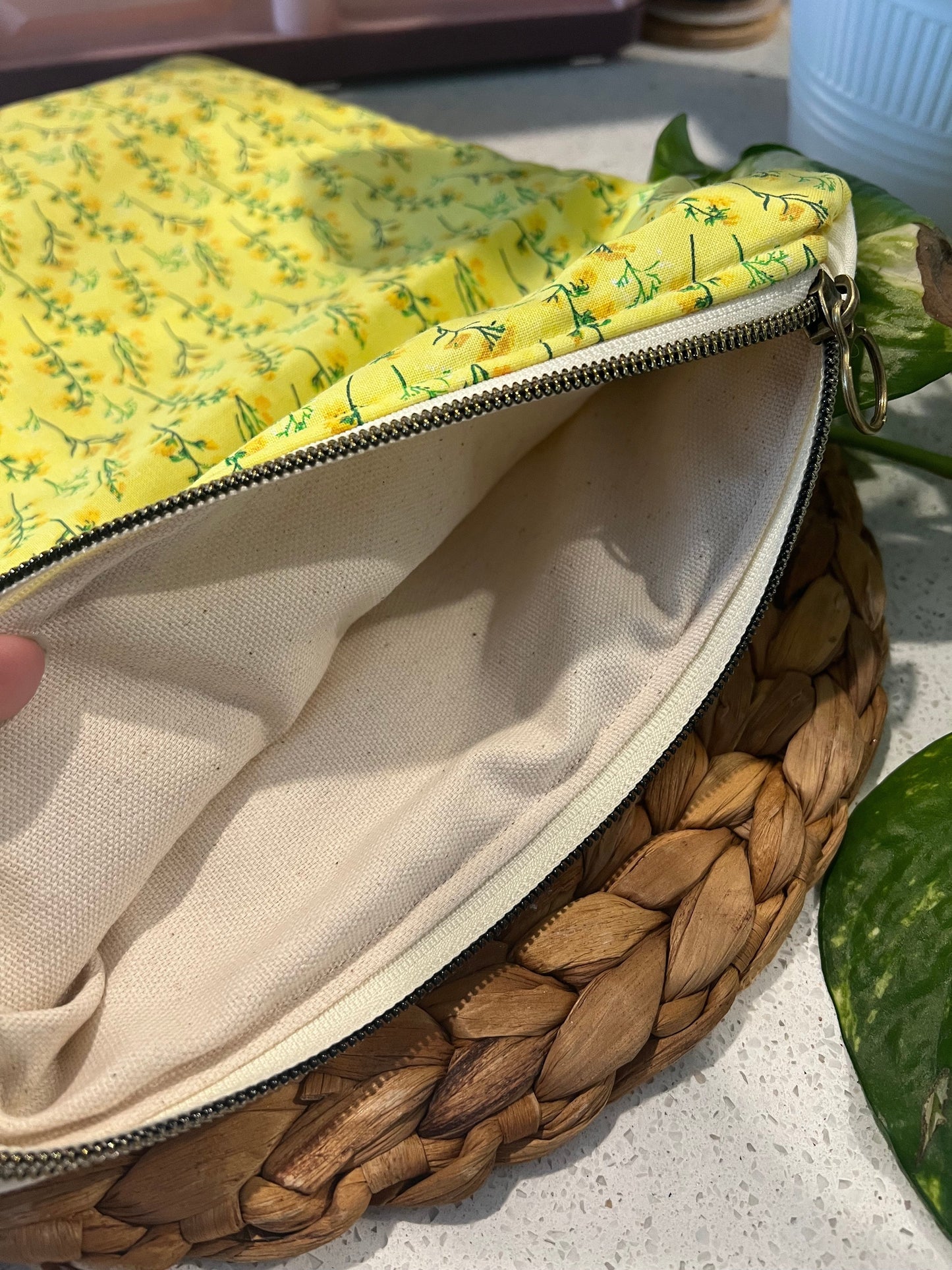 Yellow flower large book sleeve with cotton quilted design and zipper closure.