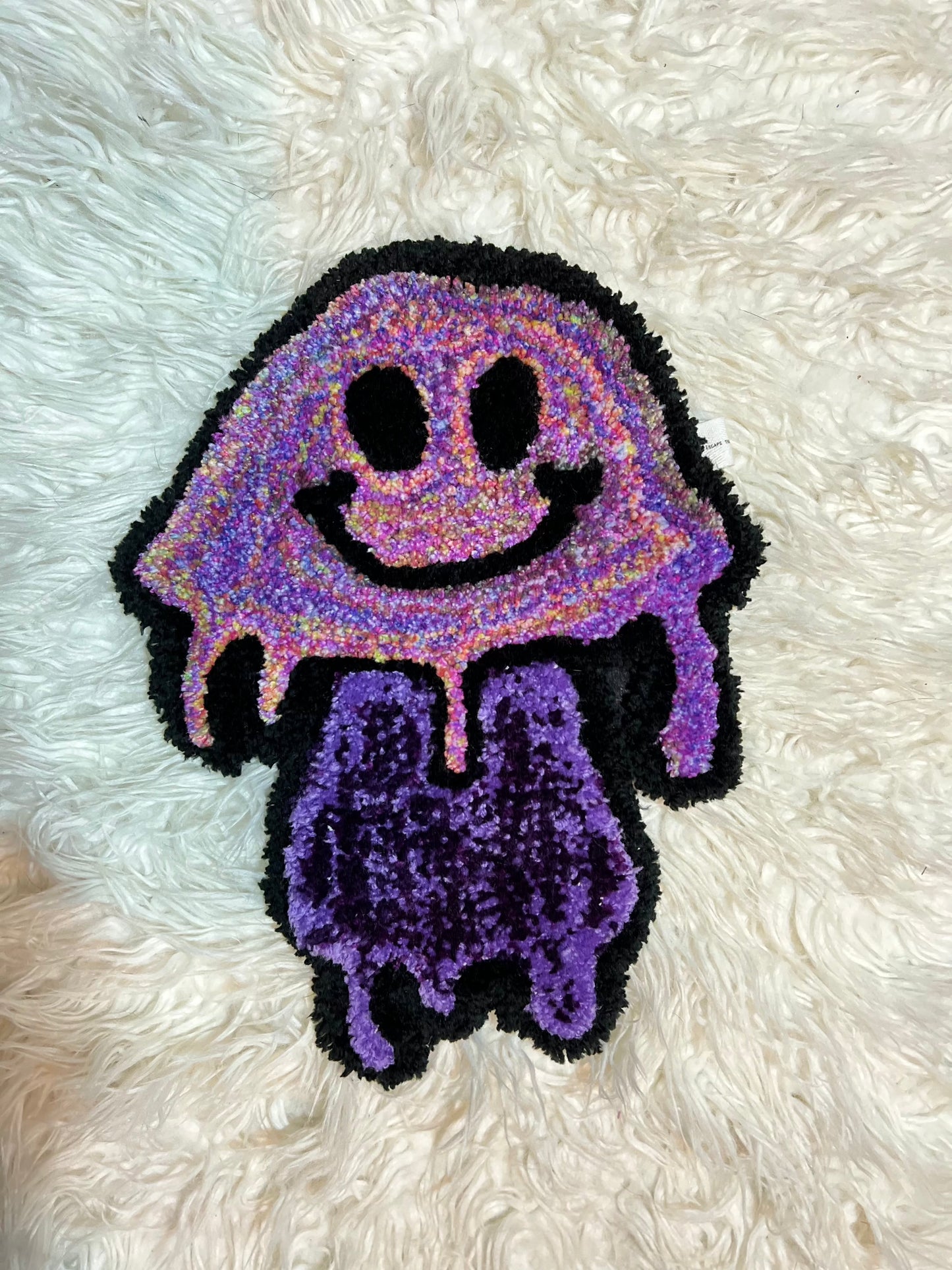 Colorful purple mushroom art with smiling face on textured surface, part of Drop 2 collection.