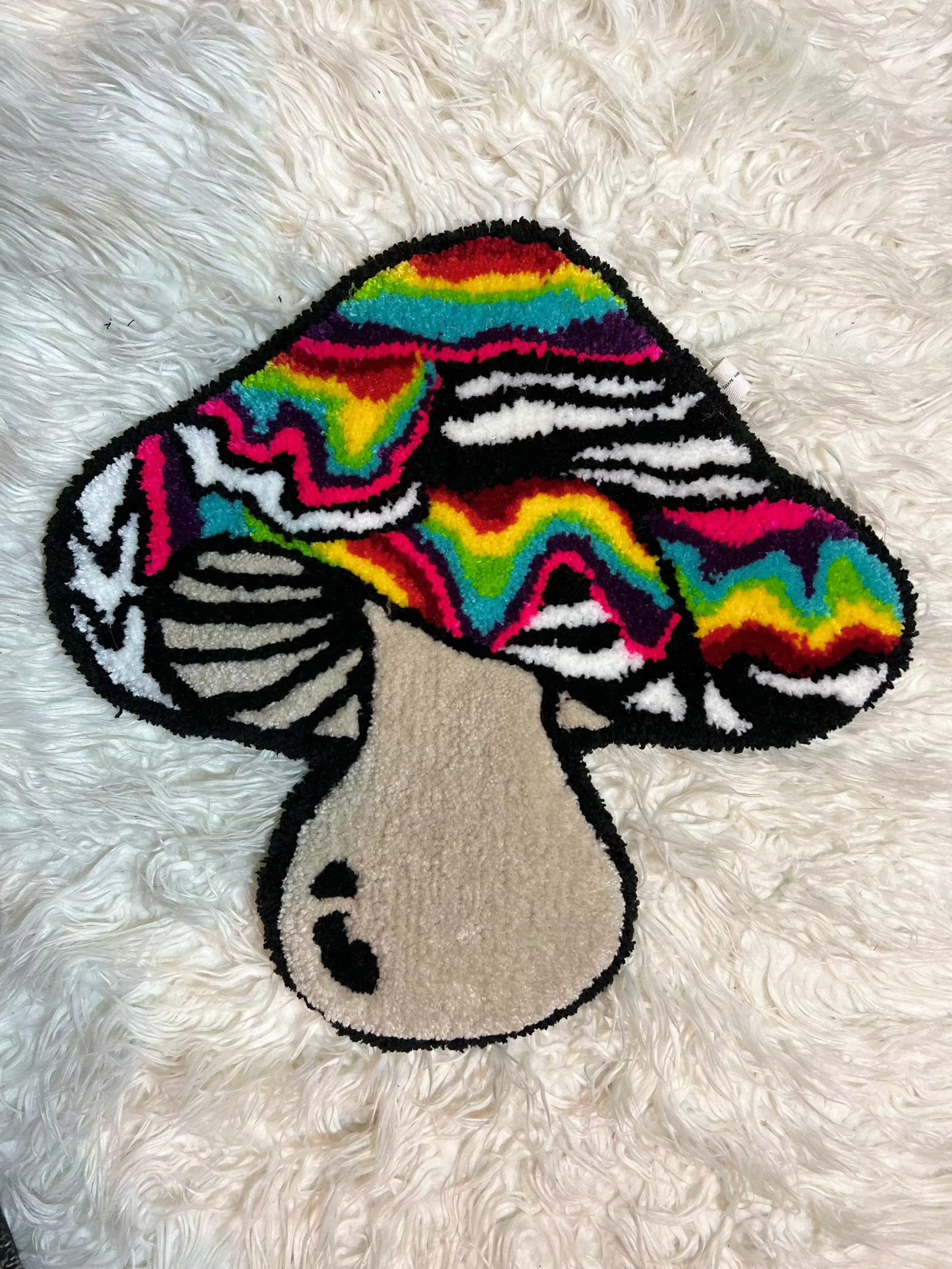 Psychedelic Drop 2 mushroom rug on white background.