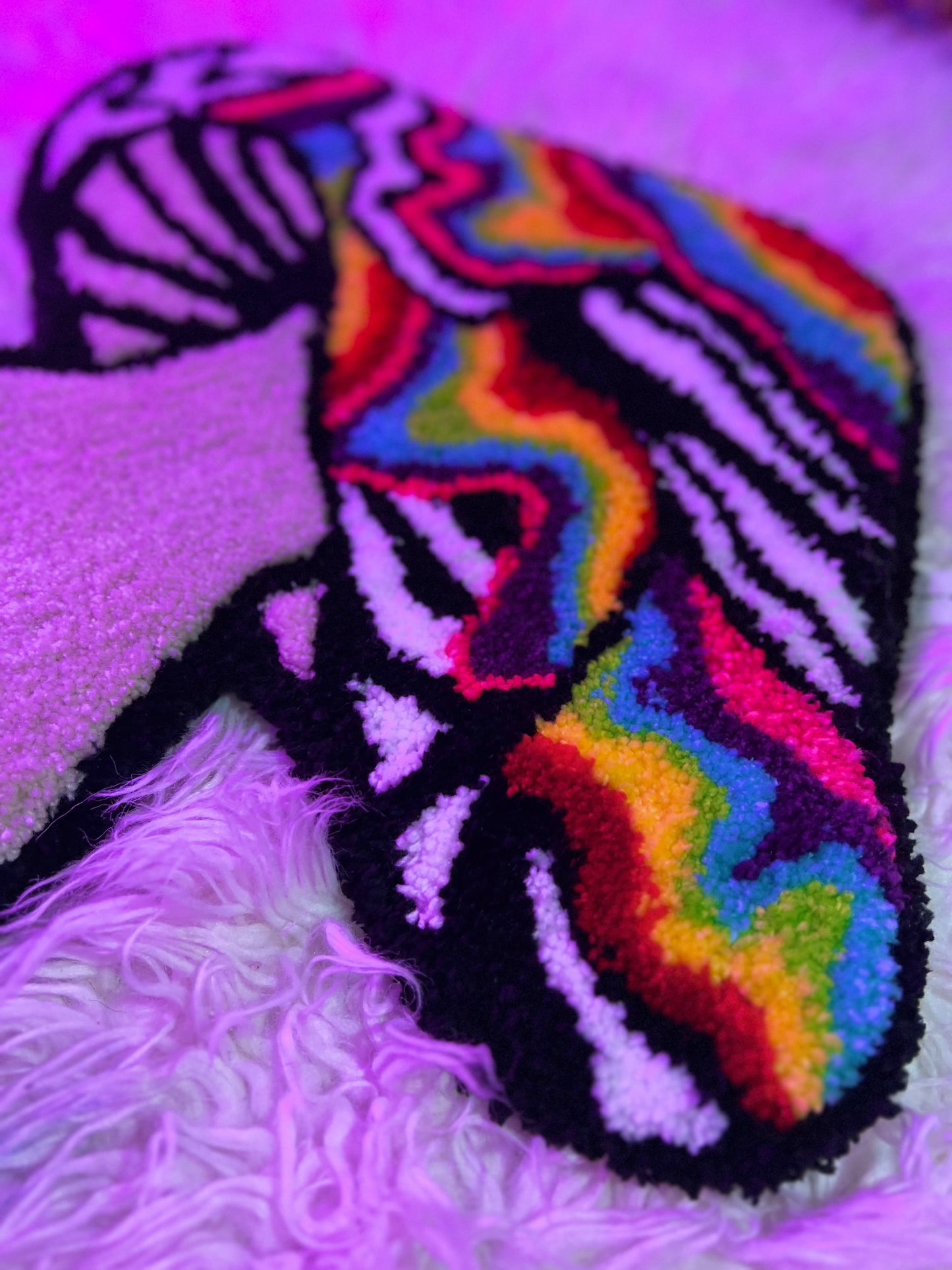 Psychedelic mushroom rug with colorful patterns, part of Drop 2 collection.