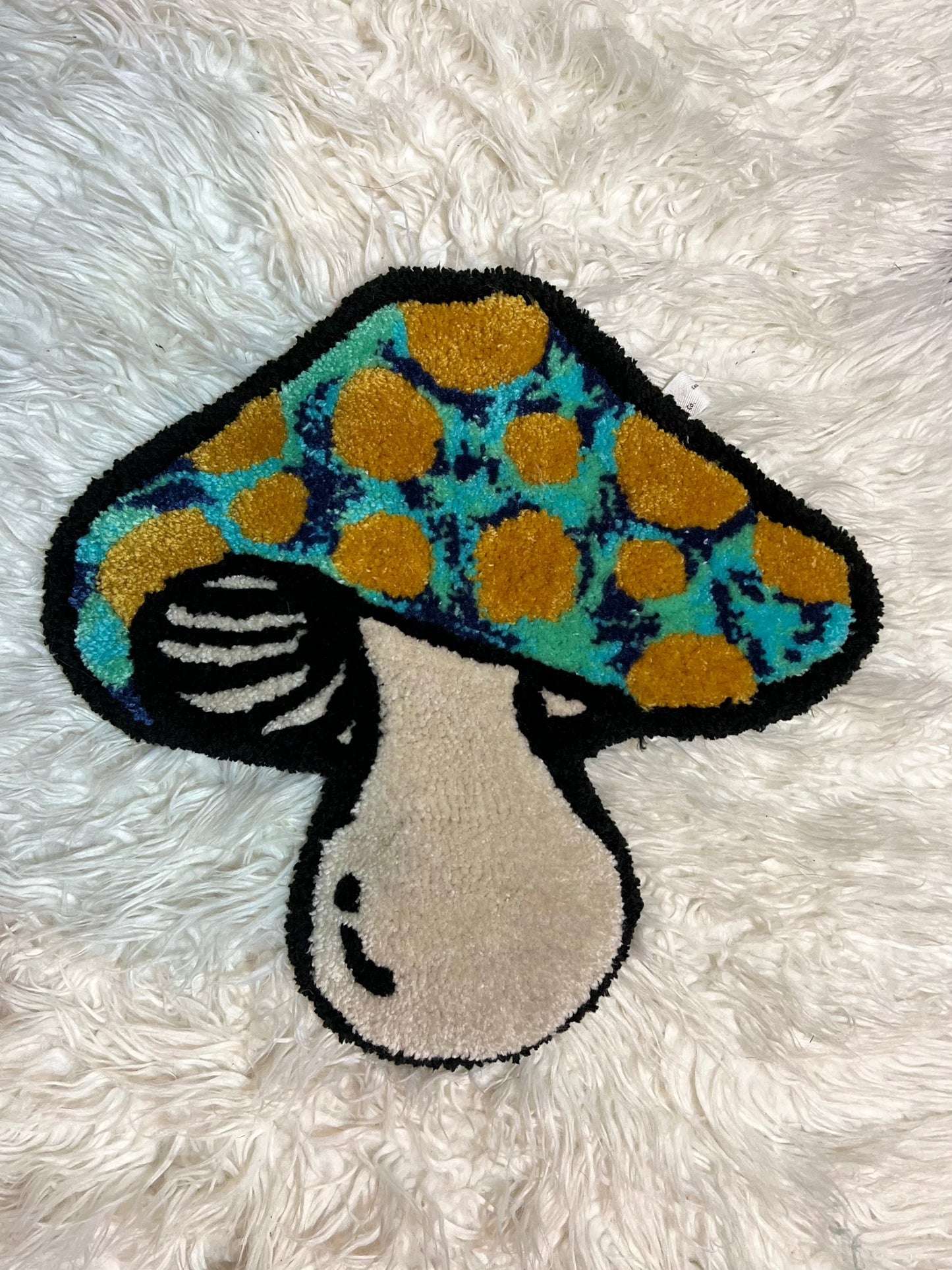Blue mushroom rug on white background for Drop 2 collection.
