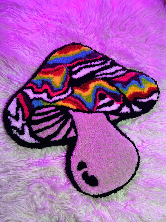 Psychedelic mushroom rug with vibrant rainbow and zebra pattern on a fluffy background.