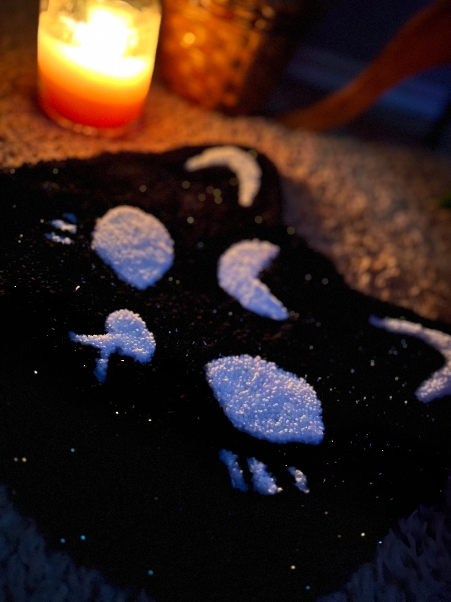Spooky cat decor in sparkle black and white, 13x13 inches, with candlelit ambiance.