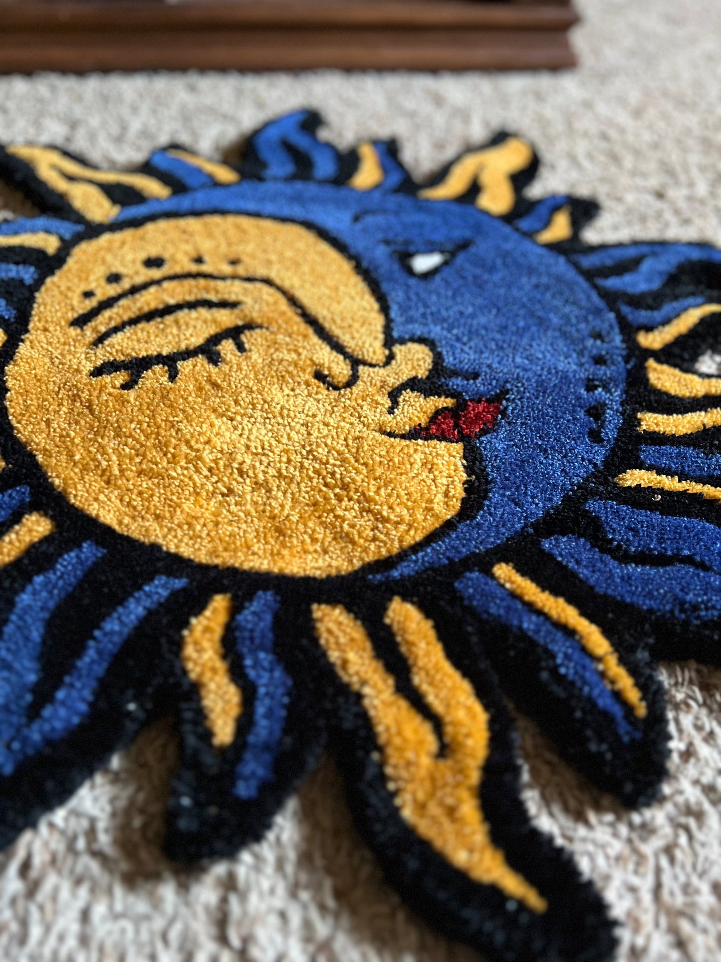 Sun-Moon drop rug, 27x27 inches, vibrant blue and gold design.