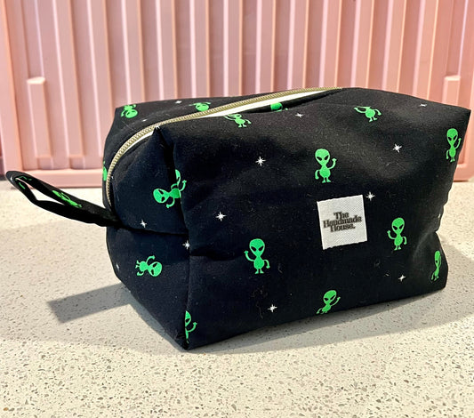 Handmade black alien-themed pouch with zipper, perfect for makeup or art supplies.