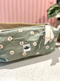 Handmade flower pouch with zipper closure, ideal for hair tools or art supplies.