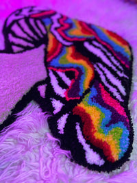 Psychedelic mushroom rug with colorful patterns, part of Drop 2 collection.