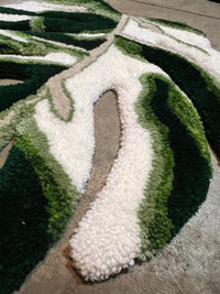 Tufted monstera leaf rug, size 32x25, green and white design.