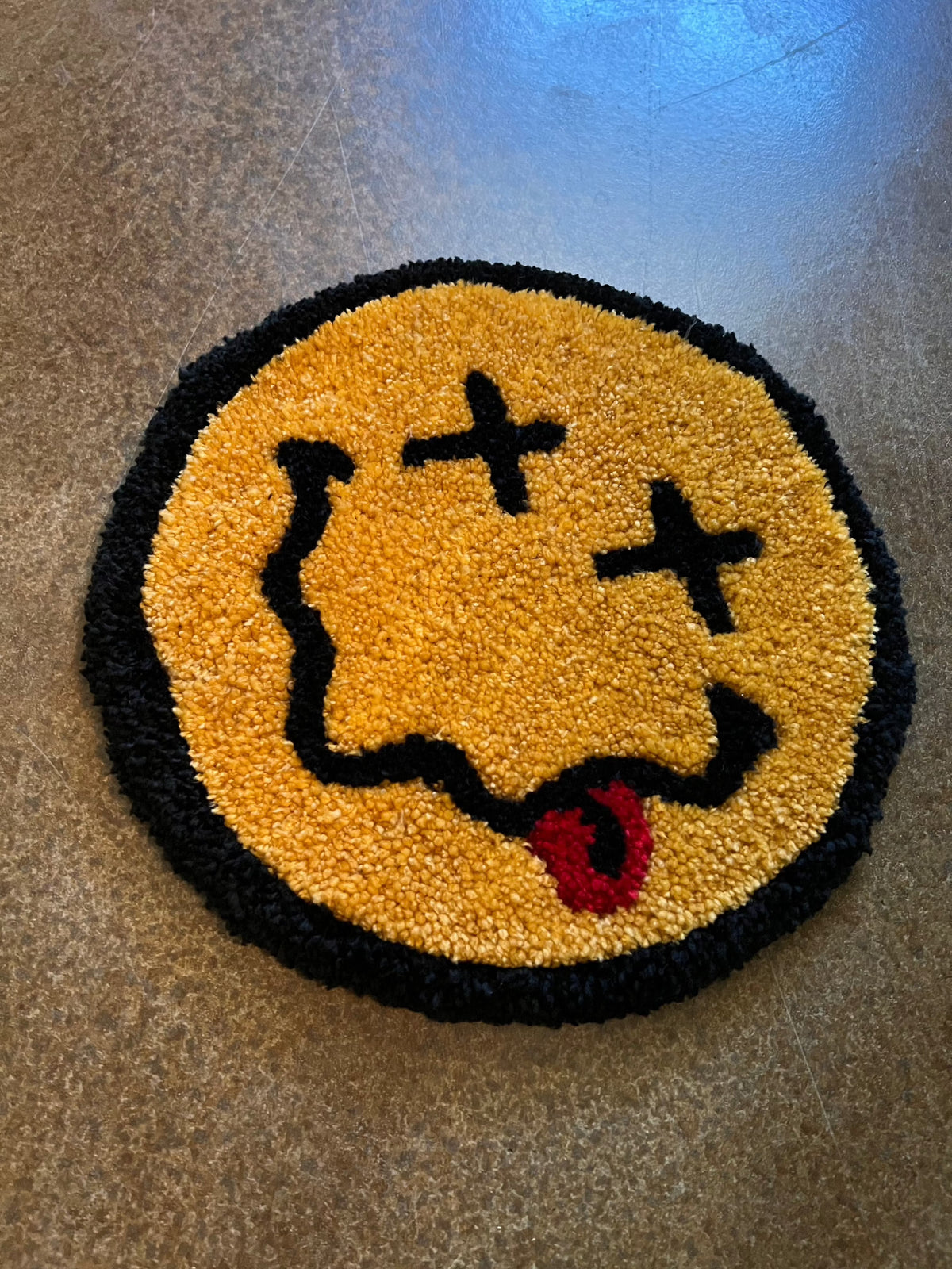 Classic Smiley Face rug, 12x12, colorful woven design.