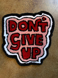 Tufted wall art with "Don't Give Up" design, size 16x15, Drop 3 collection.