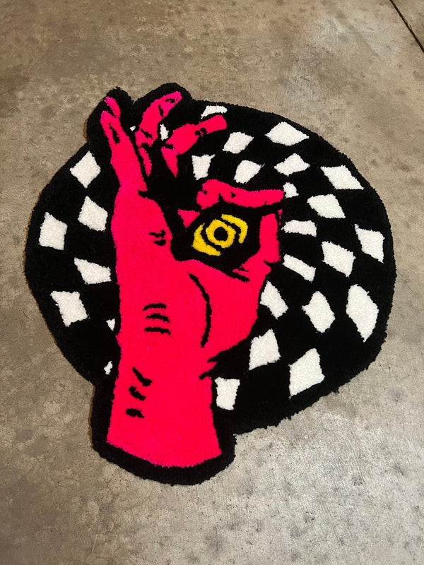 Drop 3 Hand-Eye rug, 21x24 inches, featuring vibrant red hand with black and white checkered background.