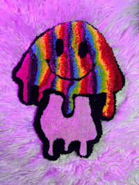 Colorful rainbow mushroom rug titled "Drop 2" on a purple fur background.
