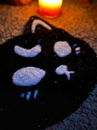 Spooky cat design in sparkle black and white, size 13x13 inches, with candlelight.